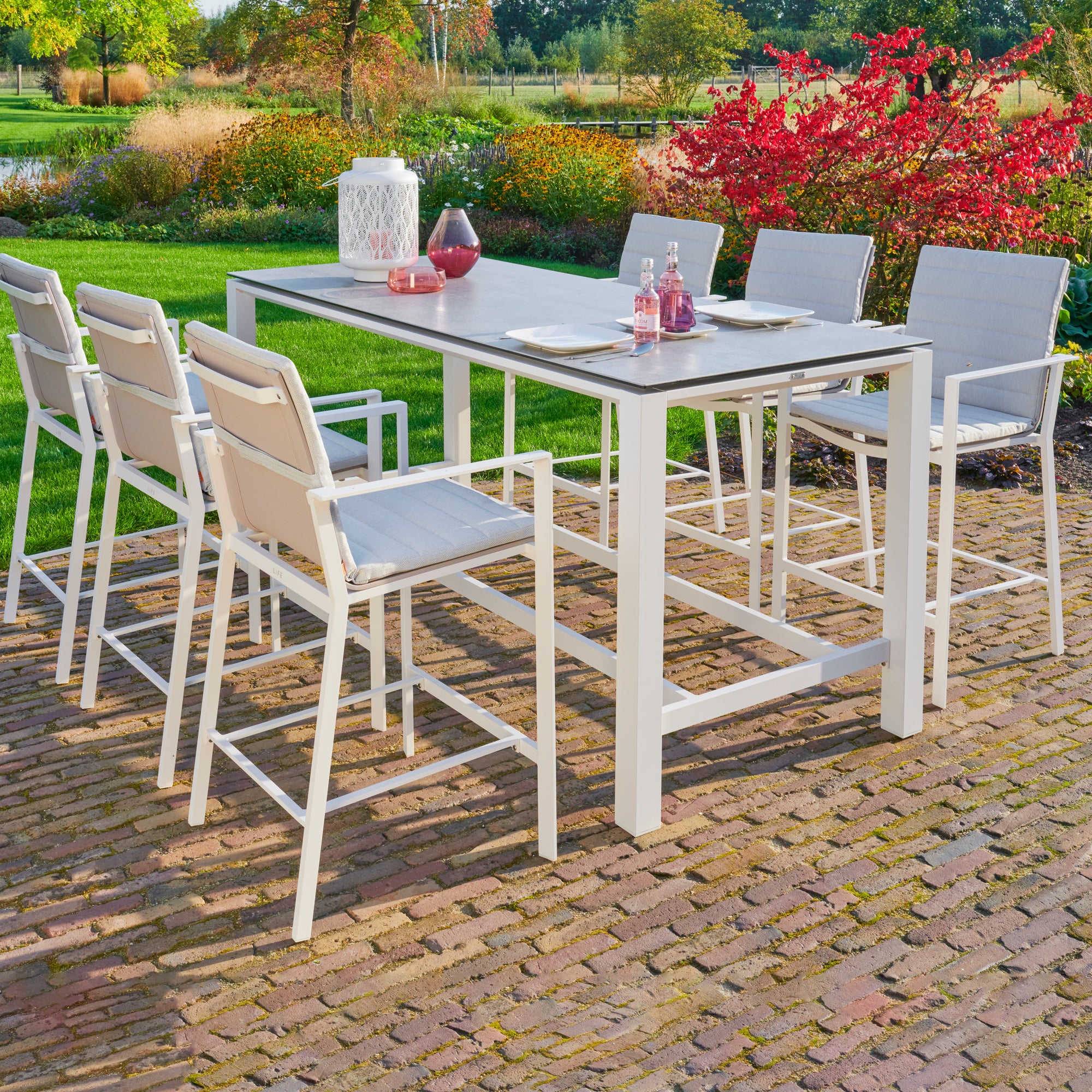 Primavera 7-Piece Bar Set - White  in a beautiful outdoor patio setting