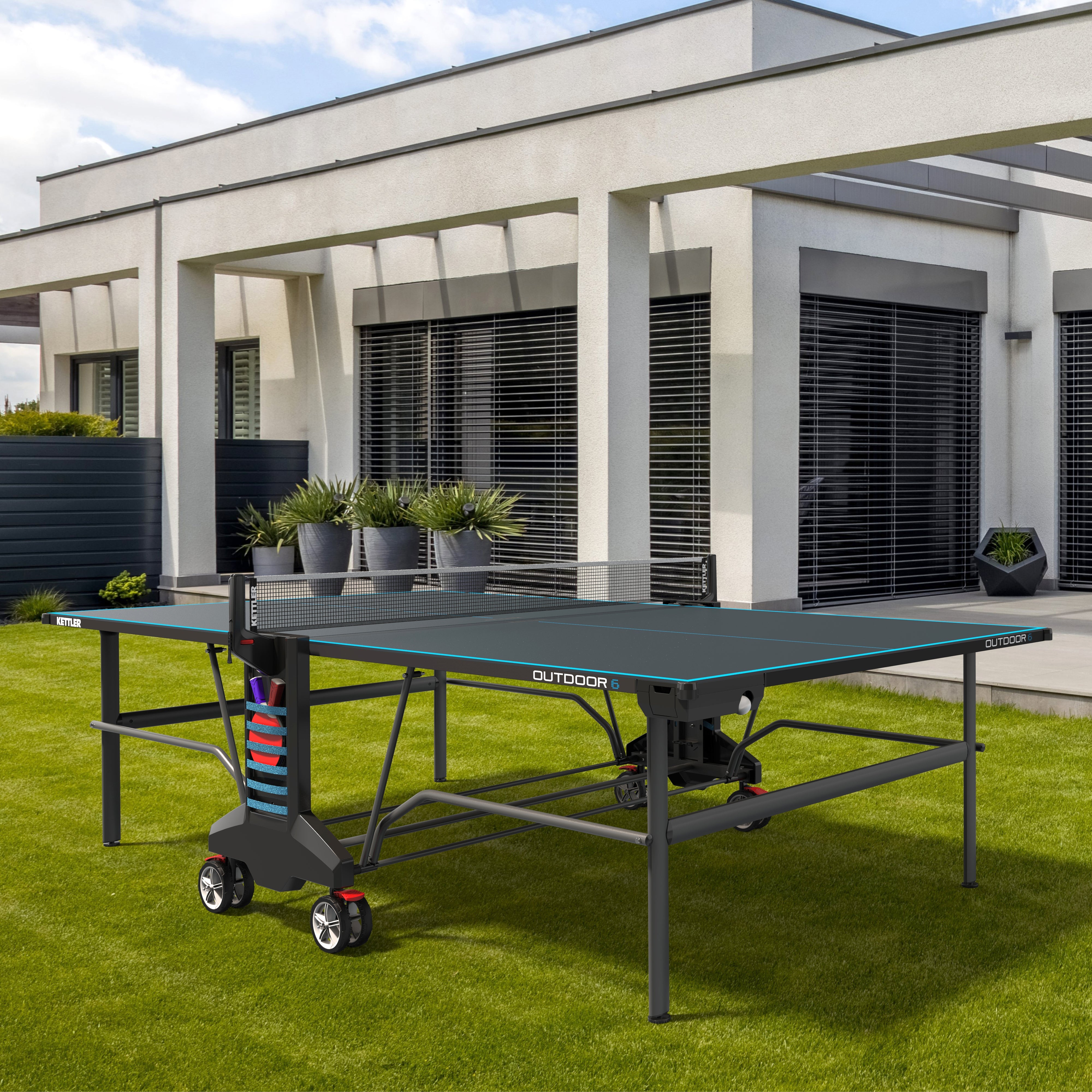 lifestyle shot of outdoor ping pong table in backyard 